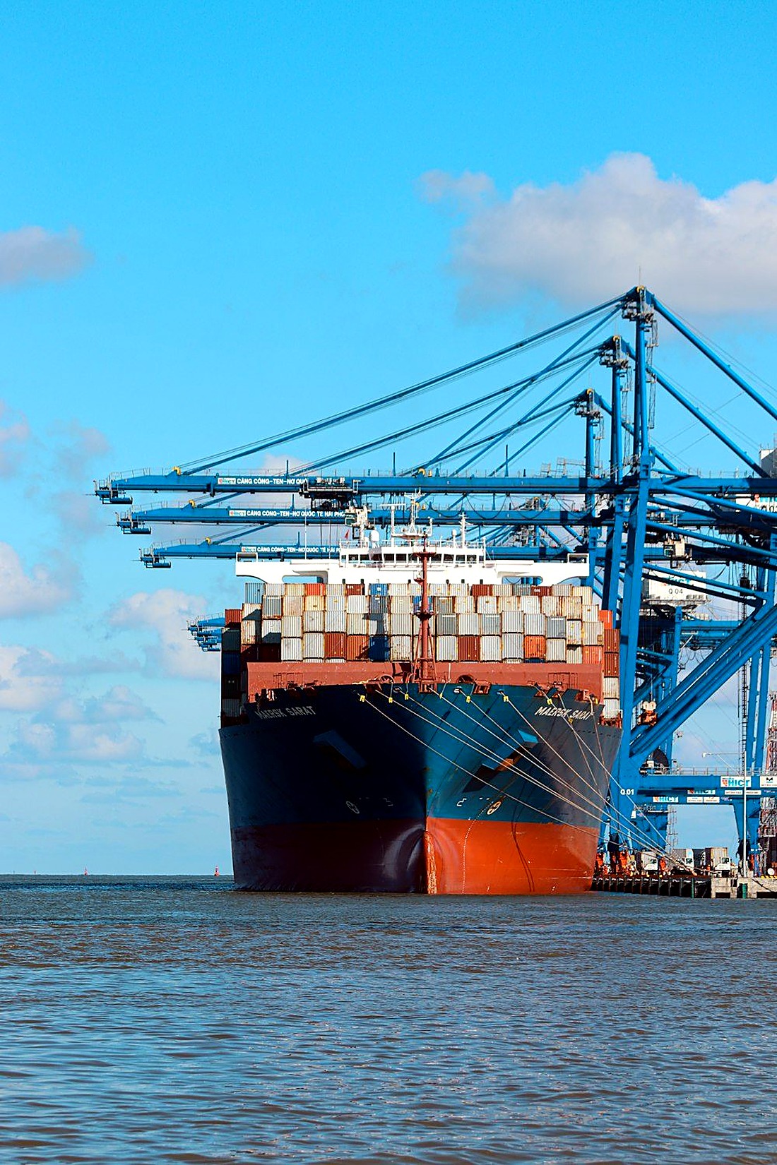 Container ship loading at port for export shipping